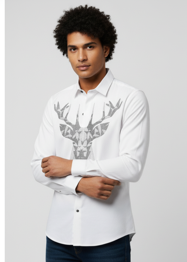 Man wearing a white shirt with a deer emblem design on a plain background